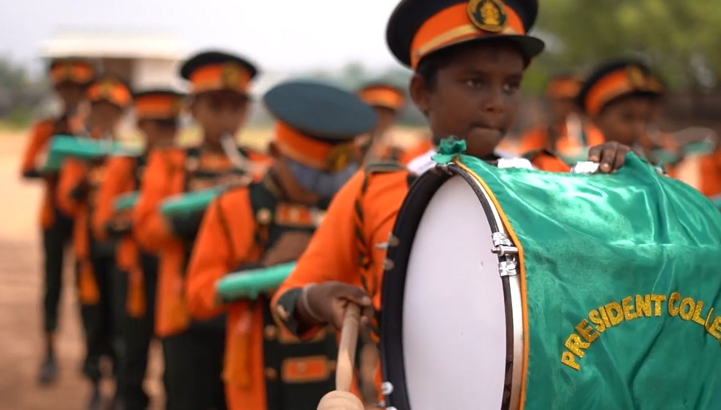 Primary western Band Association drummers with the college banner